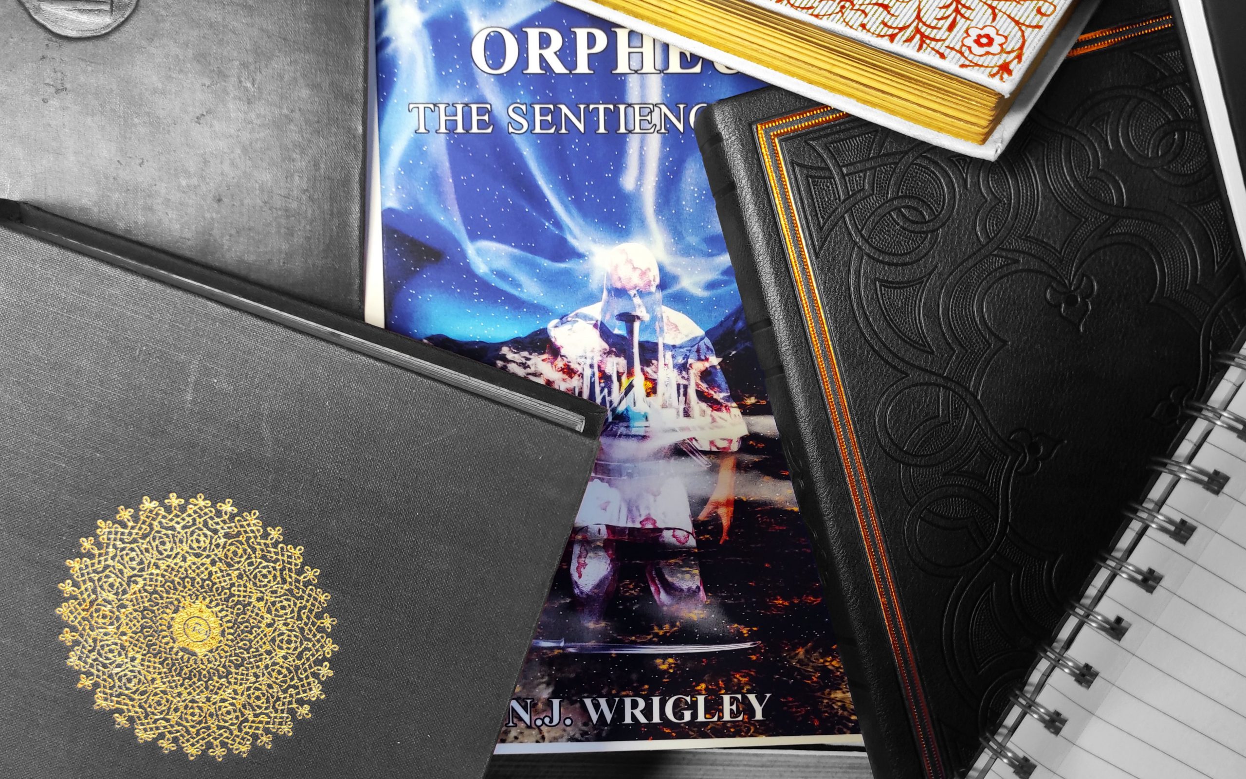 A collection of generic books, hiding a novel, entitled, Orpheus: The Sentience War, written by N.J. Wrigley. This image is there to draw readers into the short stories on ProProsel. The image implies that there are short stories from the Orpheus Universe.